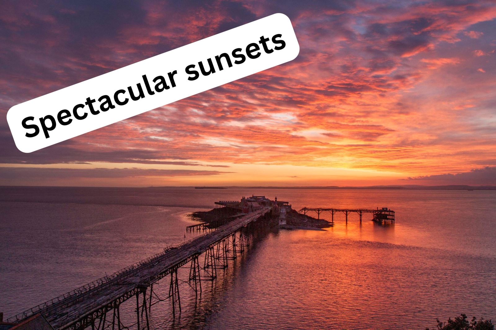 Spectacular red sunset over a pier and the sea